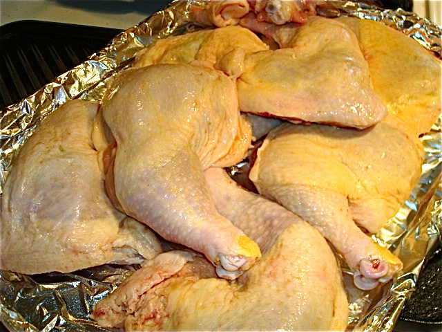 Chicken leg quarters, rinsed and waiting to be salted