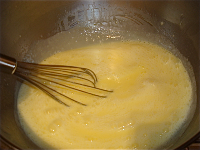 Whisk together the egg yolks, whole egg, and heavy cream til frothy