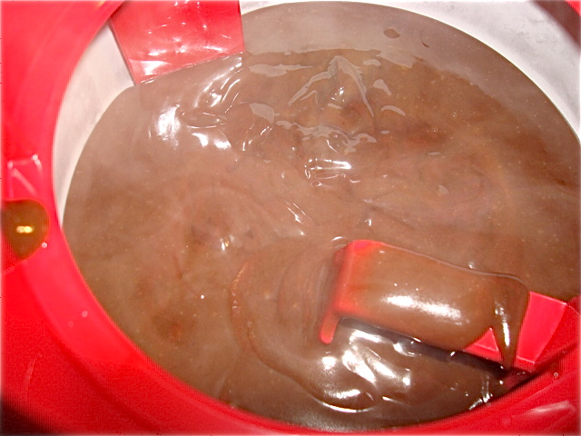 The lukewarm ice cream mixture hits the frozen bowl