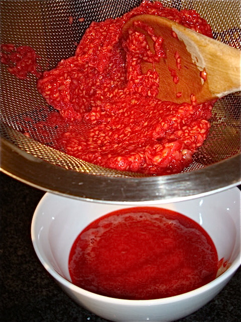 Press the raspberries through a strainer set over a bowl