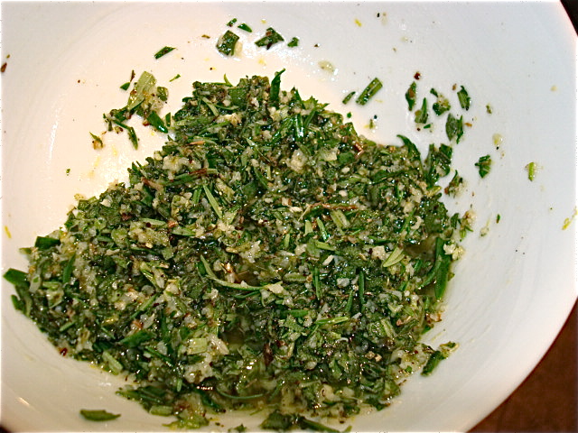 Herb marinade ready to apply to lamb ribs