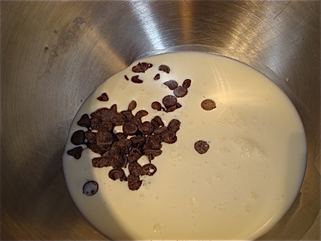 Add the cream, chocolate, and corn syrup to the top of your double boiler