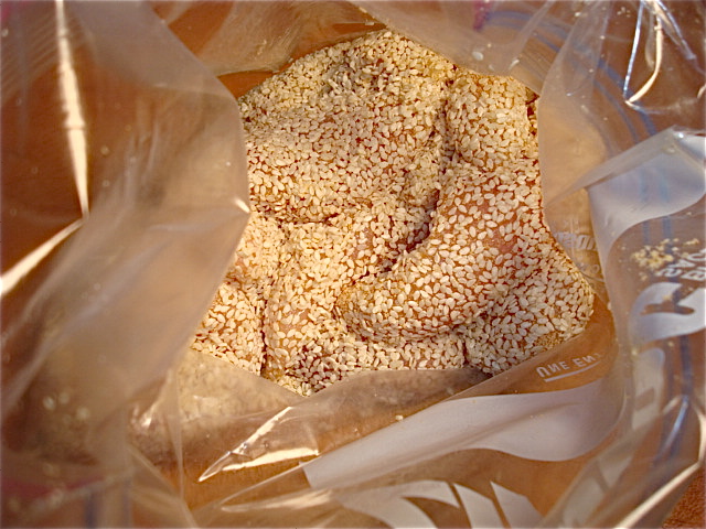 Toss to coat evenly with sesame seeds and garlic