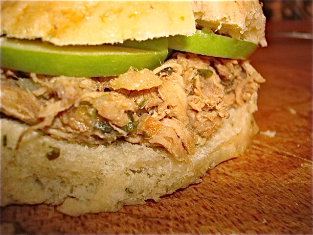 On a bun with some crisp granny smith apple slices