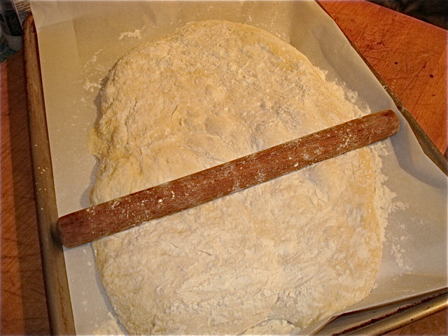 Flatten your dough out with your hands, then roll it out