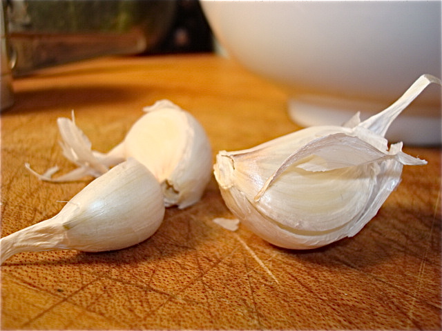 Mash up the garlic and add it to the oil