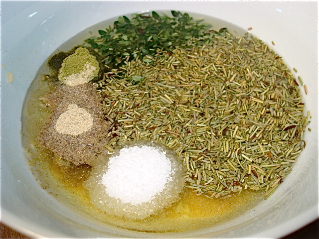 Add the herbs and spices to the garlic and oil