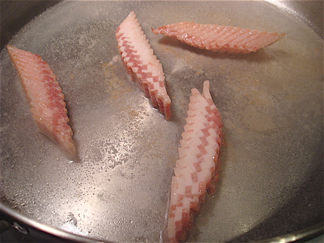 Add the bacon to the pan with a little water