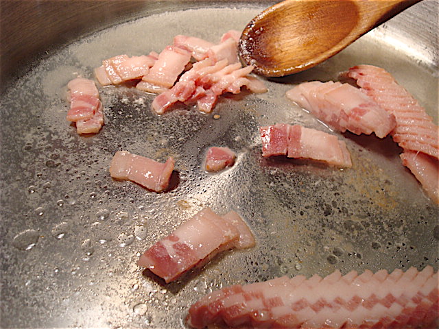 Stir the bacon as it cooks