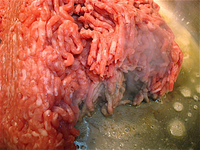 Add the ground meats to the pan