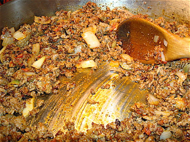 Stir in the tomato paste and start to deglaze your pan