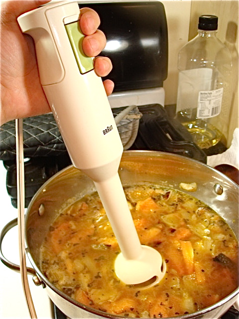 Put the stick blender in the pot