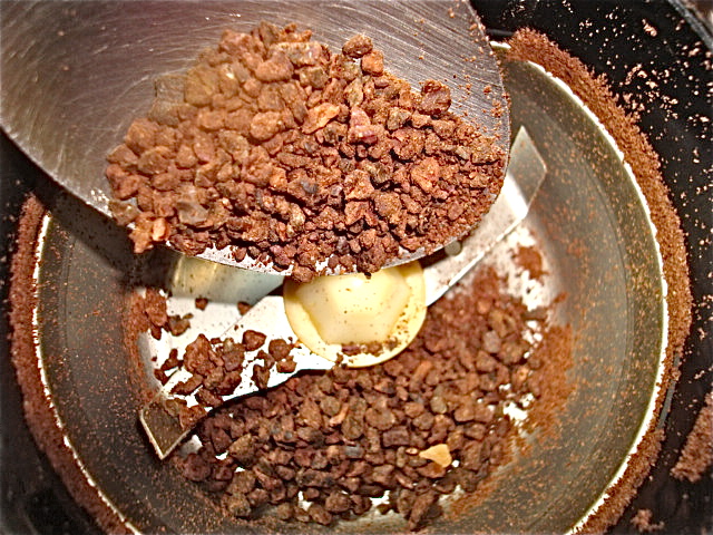 Next, grind the nibs in a coffee grinder