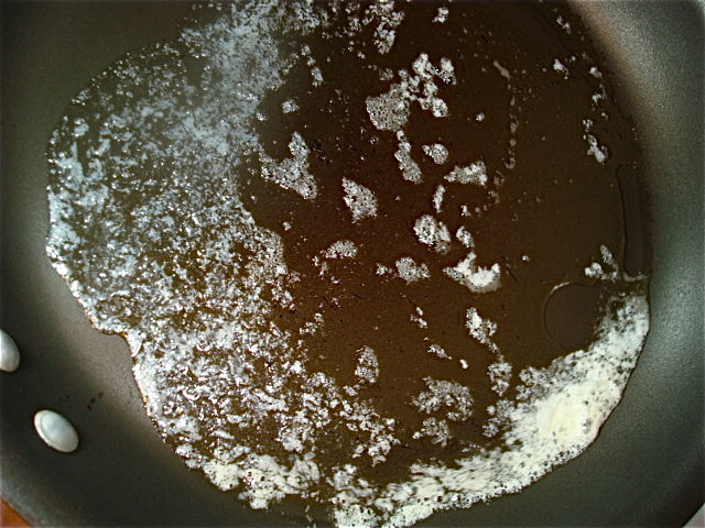 Tip the pan to coat it with melted butter