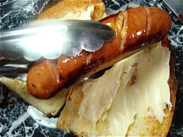 Add the sausages to your roll