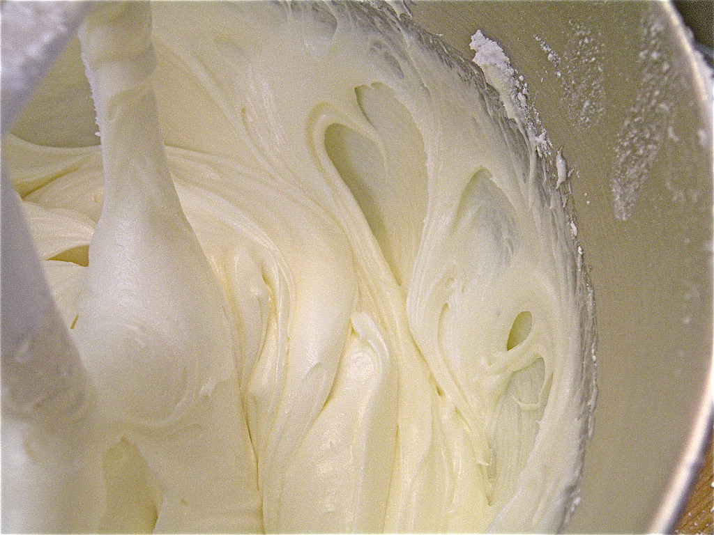 Add the sugar to the butter and cream cheese in batches