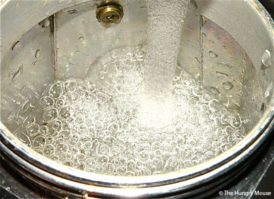 How to make stovetop espressp: Fill the pot with water 