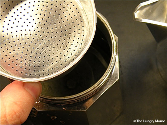 How to make stovetop espresso: Fill the filter basket with coffee